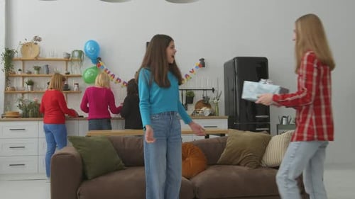 Teen Receives Birthday Gift From Friend at Party