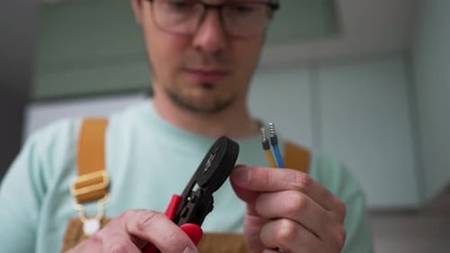 Man using Crimping Tool on Electrical Wires