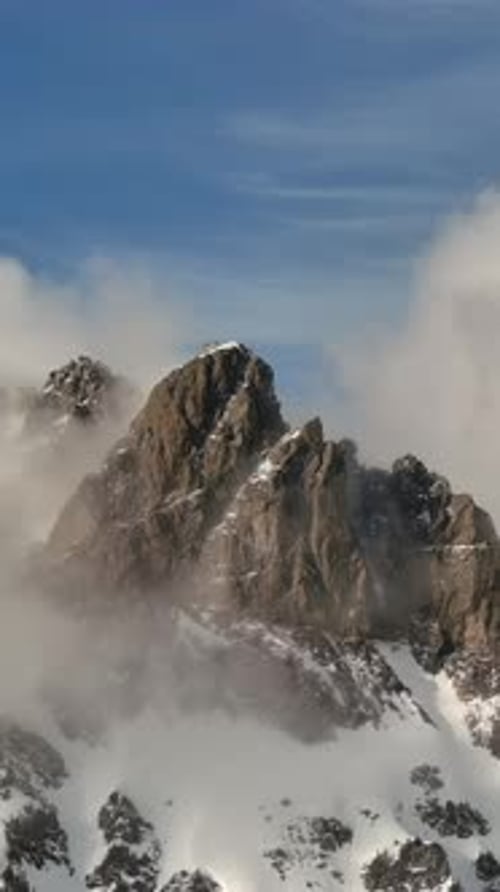 Snowy Mountain Peaks With Clouds. British Columbia, Canada.