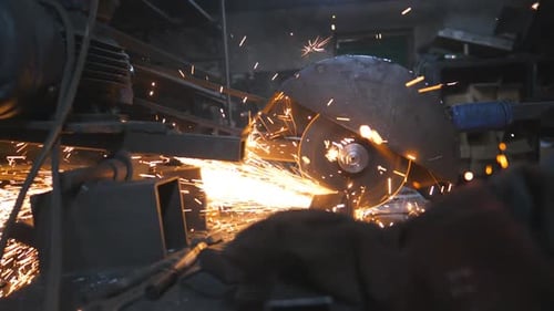 Circular Saw Sawing Steel at Industrial Manufacture Many Bright Sparks Fly From Hot Metal Saw