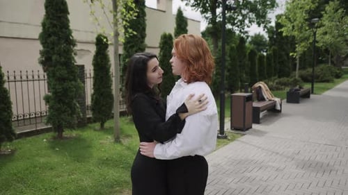 A Couple Joyfully Dances in a Park Sharing Chemistry and Warmth