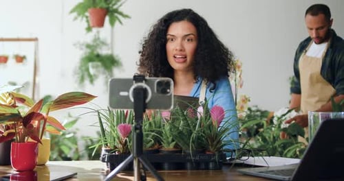 Woman Filming Gardening Blog in Bright Indoor Setting