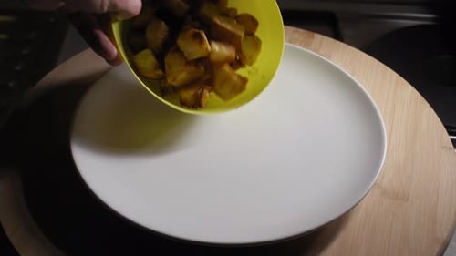 Adding Fried Potatoes to a Plate, Cooking Dinner, Vegetarian Food