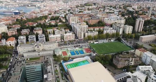 Aerial view of sports complex and cityscape, Italy.