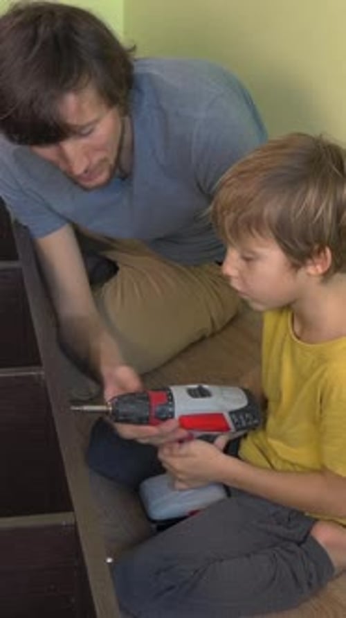Father and Son Working Together on a Wood Project