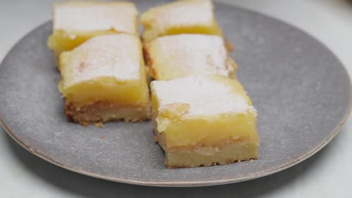 Placing lemon cake slice