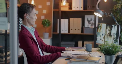 Young Businessman Talking to Female Partner at Virtual Meeting Making Online Video Call with