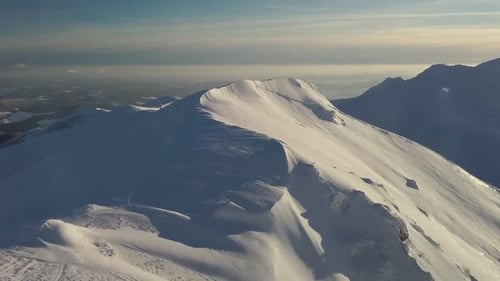 Snowy Alpine Mountain Ridge in Winter Landscape