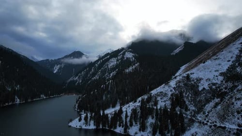 Kolsai Mountain Lake in the Winter Forest