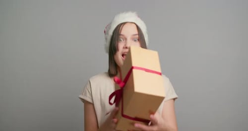 Excited Woman Receives Christmas Gift