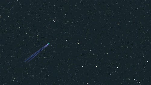 Streaking Comet Flies Through Starry Cosmos