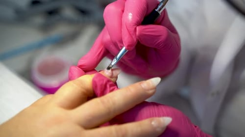 Close up of beautiful female hands manicure treatment in beauty salon 4K