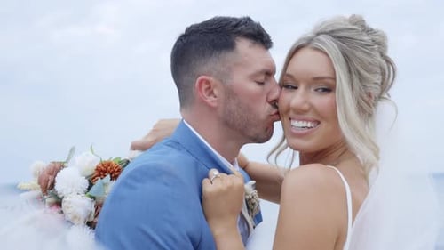 Romantic beach stroll with a breathtaking sunset and a glowing couple in love