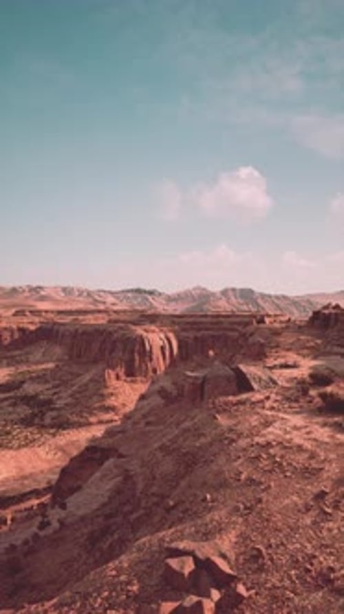 Barren Desert Landscape With Rocks and Sky