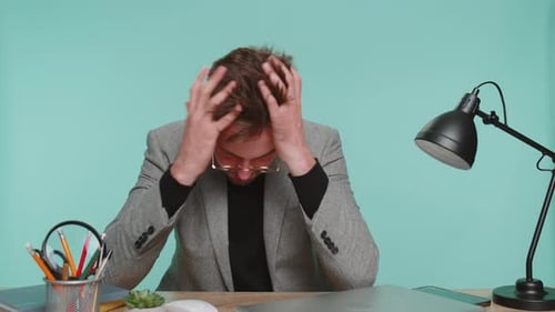 Young Adult Experiencing Computer Problems in Office