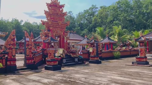 Colorful Temple Shrines in Tranquil Tropical Setting