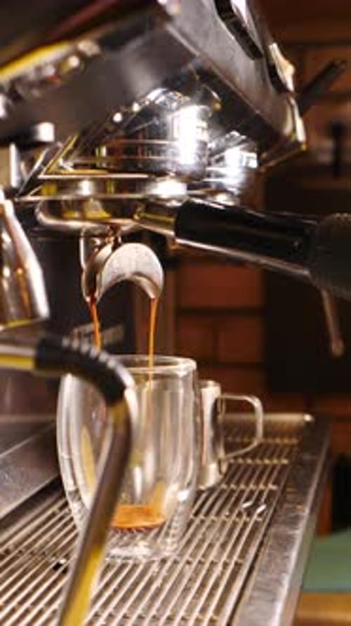 Close-up of Espresso Pouring into Glass Mug