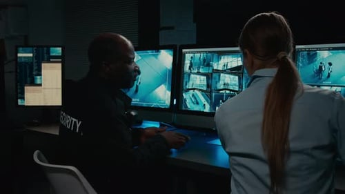 Security Guards Watch Security Camera Footage