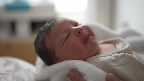 Close-up of a Sweet Newborn Baby Sleeping Peacefully