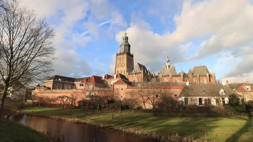 Winter landscape timelapse with shadows moving and clouds passing by over picturesque historic city