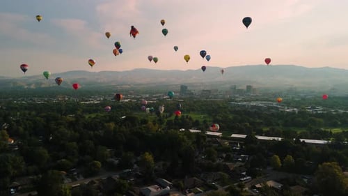 Aerial View of Hot Air Balloons over City
