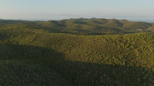 Drone Captures Majestic Mountain Valley at Golden Hour Sunrise