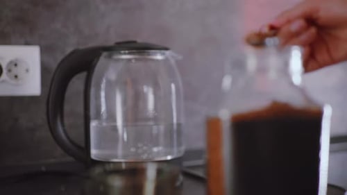 Woman Making Coffee with Instant Granules at Home