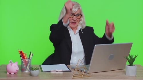 Senior Business Office Woman Analyzes Financial Charts Celebrate Success Win at Home Workplace Desk