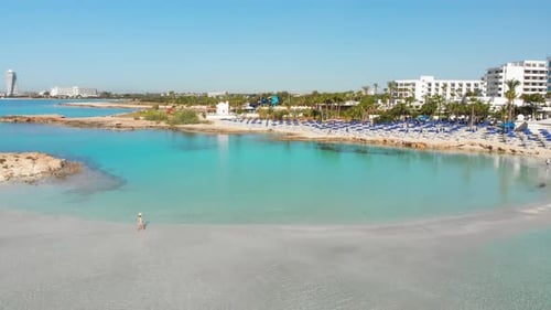 Tourist Relax Walk On White Sand Nissi Beach