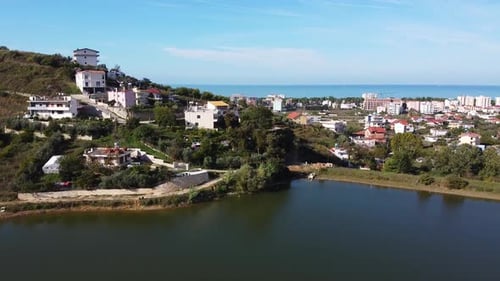 Aerial above a small lake near the coastal village of Golem in Albania.