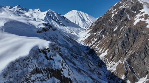 Aerial view of beautiful snowy mountains in Gudauri, Georgia