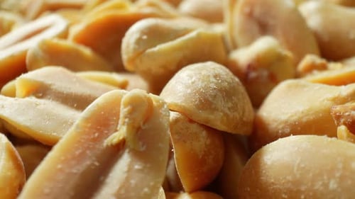 A detailed macro view of roasted peanuts.
