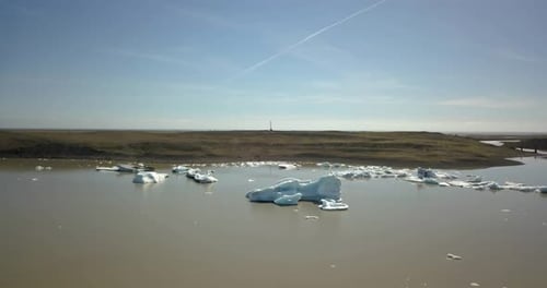 Glaciers icebergs chunks in the water of iceland, aerial