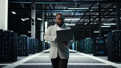 Programmer in Data Center Using Laptop Testing Equipment Failover Scenarios