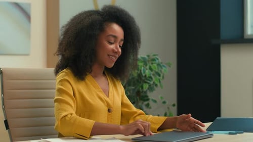 Woman Closes Laptop and Leans Back to Relax