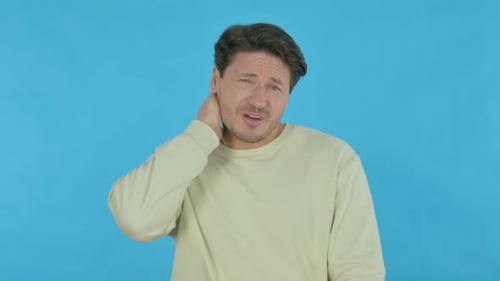 Adult Man Holding Neck in Pain Mid Shot