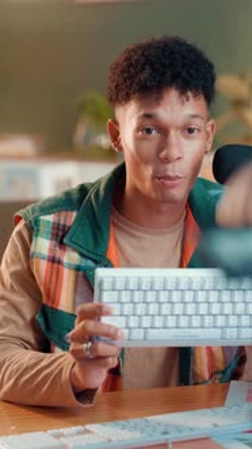 Keyboard, live streaming and promotion with man in studio for gaming pad, ergonomic and influencer
