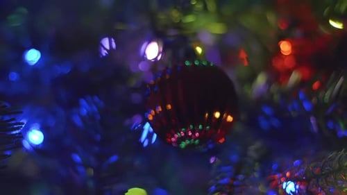 Christmas Bauble on Tree with Twinkling Lights