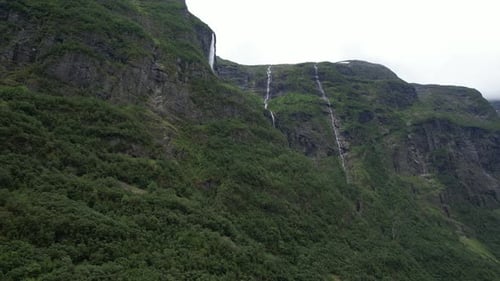 Lush Mountains with Cascading Waterfalls Aerial View