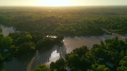 Aerial View of Sunset over Lush River Vegetation