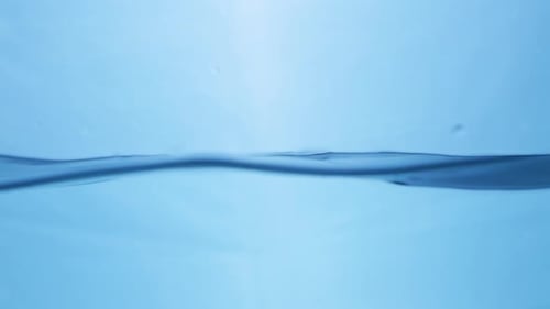 Slow motion of Water waves on surface with blue background