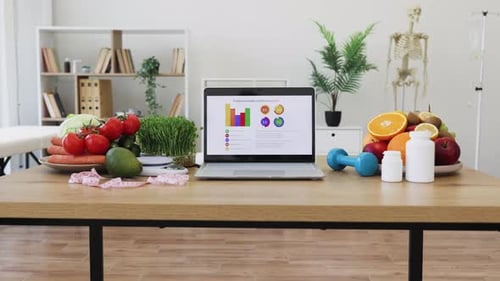 Healthy Food with Laptop Displaying Diet Data