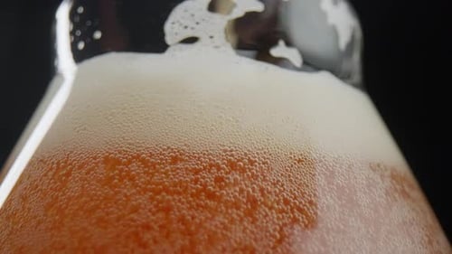 Close-up of beer being poured into a glass