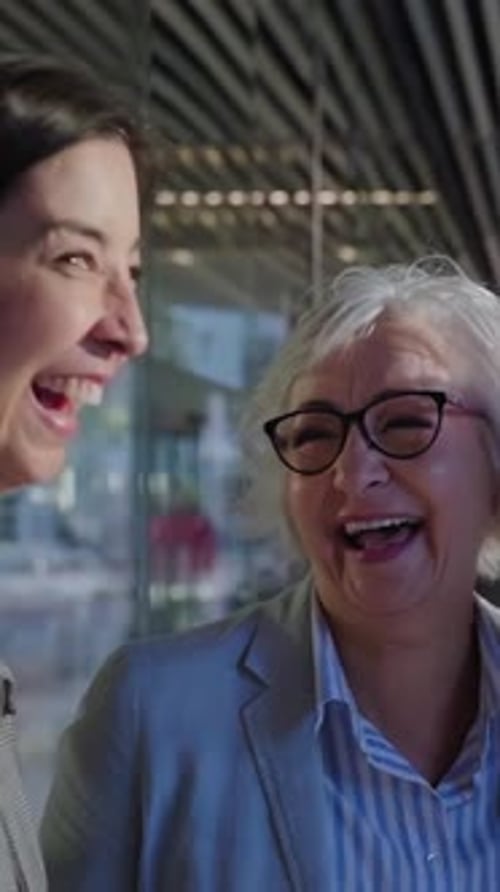 Cheerful Group of Mature Businesswomen Gathering Outside Work Office Laughing Together