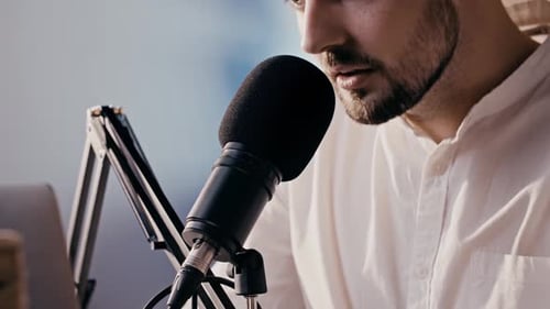 Bearded Guy Blogger Speaking Into Microphone in Slow Motion Close Up Caucasian Man Recording His