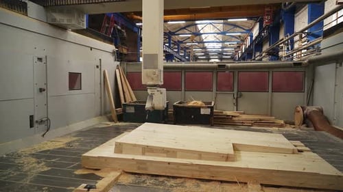 Woodworking Shop That Features a CNC Machine Along with Various Needed Materials Stock Clip