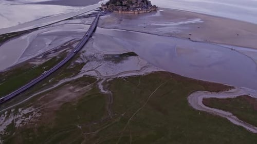Aerial view of historic abbey and church on island, France.
