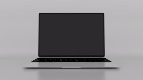 Laptop opens green screen display and zoom in on a white background