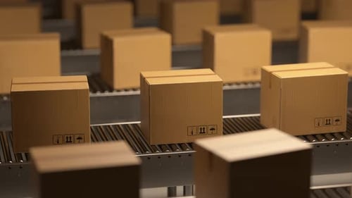 Cardboard boxes moving on multiple conveyor belts