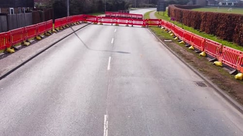 Aerial low flight in an empty road.
